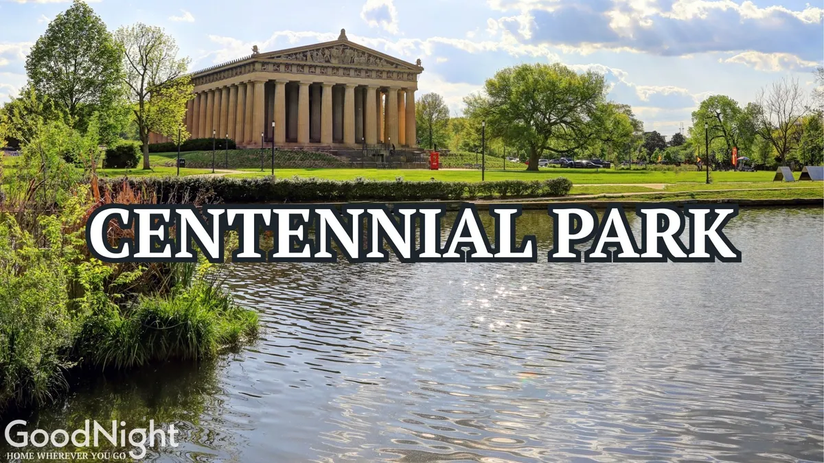 A serene park setting with a replica of the Parthenon reflected in a peaceful lake, surrounded by greenery. This inviting spot is ideal for picnicking, walking, or attending local festivals with family.