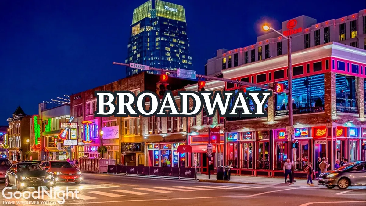 This exterior image captures the neon lights, bustling restaurants, a lively crowd, and the city skyline at night. The energetic atmosphere is palpable, with people engaged in nightlife activities: dining, listening to live music, and exploring vibrant streets.
